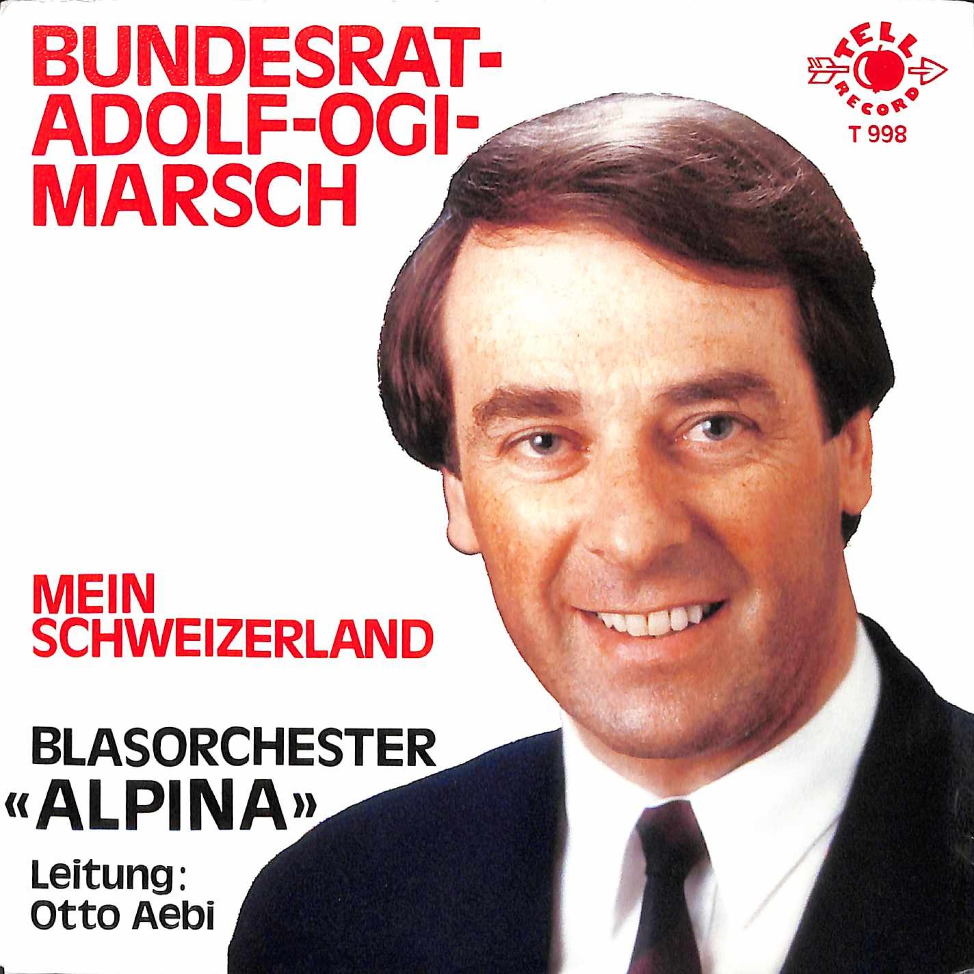 Single Vinyl: Blasorchester Alpina - Bundesrat-Adolf-Ogi-Marsch + Mein Schweizerland Single Vinyl: Blasorchester Alpina - Bundesrat-Adolf-Ogi-Marsch + Mein Schweizerland